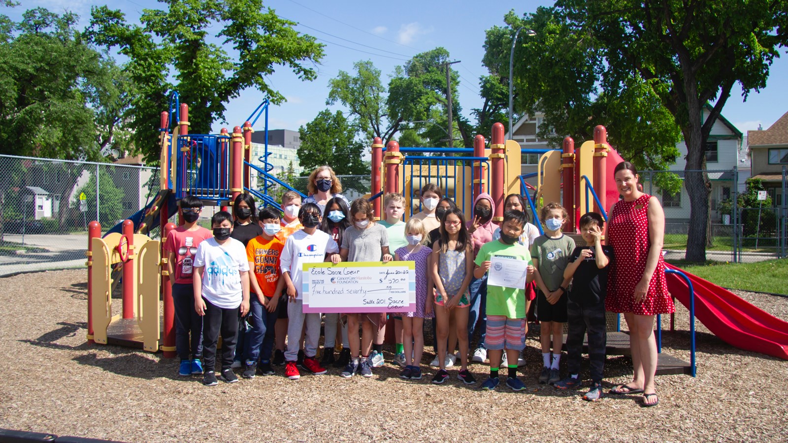 Sacré-Coeur students with their donation for the CancerCare Manitoba Foundation.